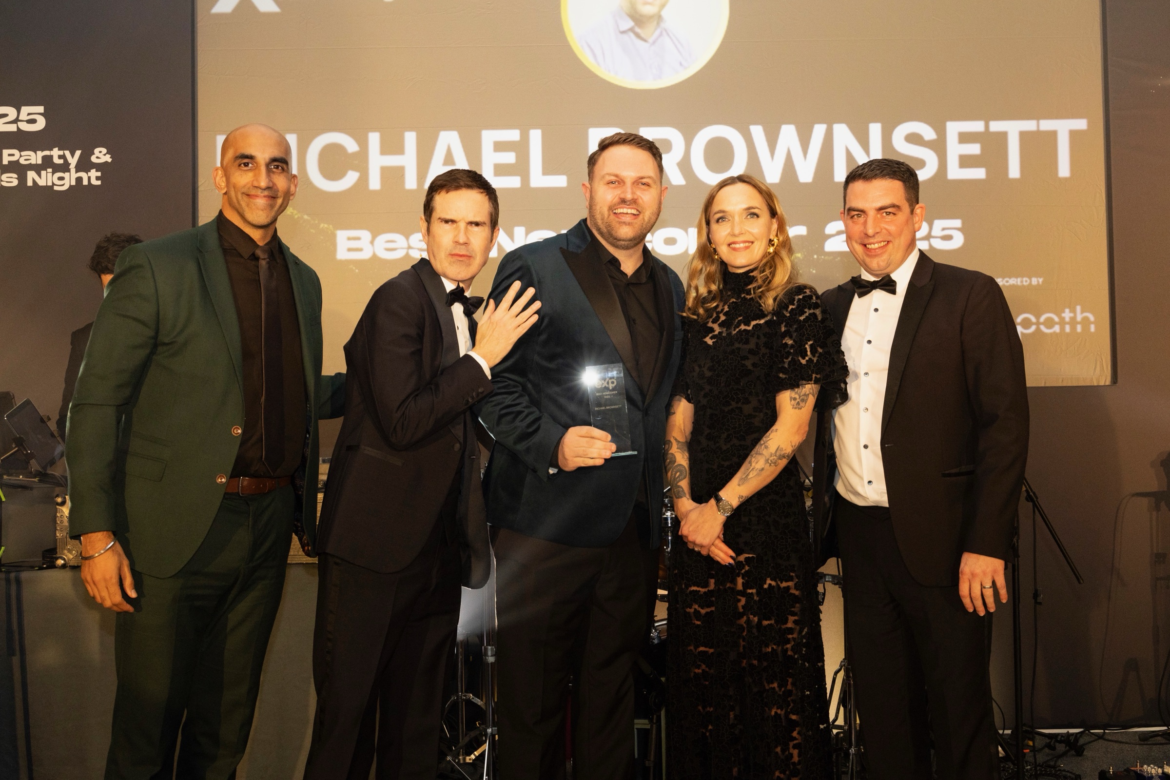 Michael Brownsett receiving the eXp UK Best Newcomer 2025 award